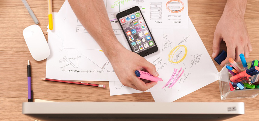 Mobile phone, pens and paper